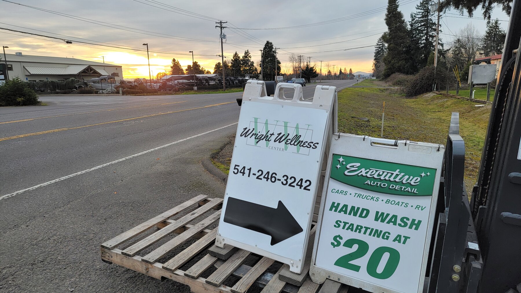 Executive Auto Detail shop sign in Eugene, Oregon at sunset